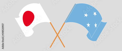 Crossed and waving flags of Japan and Micronesia