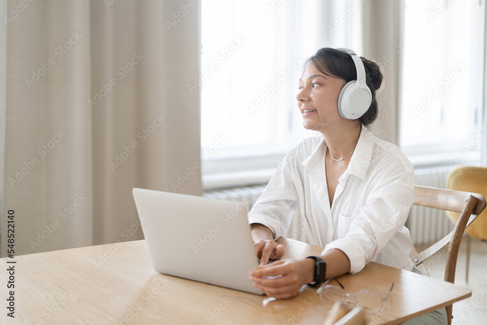 Remotely online, the website uses a laptop to work on its project. Freelancer woman routine job Remotely online, the website uses a laptop to work on its project. Freelancer woman routine job