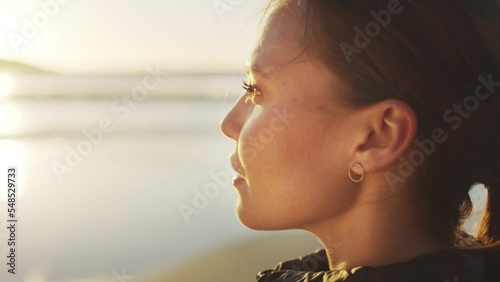 Beach, thinking and calm woman with fitness, wellness and outdoor healing for peace, inspiration and healthy lifestyle on sunset horizon. Ocean waves, focus and self care girl on holiday in nature