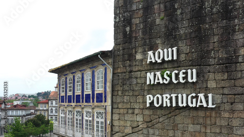 Cityscape of Guimaraes, Portugal - Wall with the inscription 