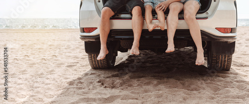 Bilde på lerret Family with Car travel driving road trip summer vacation in car in the sunset, D