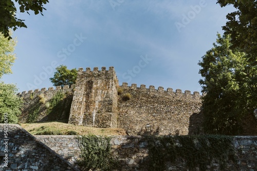 Low-angle of the castle of Vila Vicosa against the clear sunlit sky background, Portugal photo