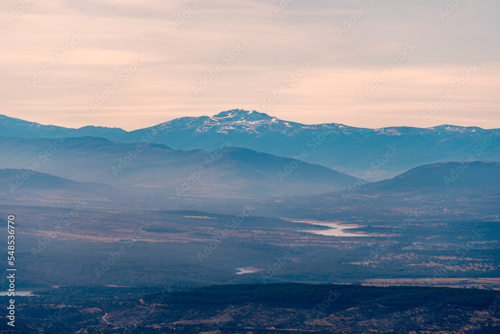 Tranquil mountain range valley in twilight Tranquil mountain range valley in twilight