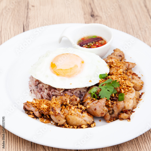 Brown rice with fried garlic chicken and fried egg, Thai healthy food
