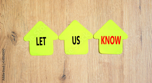 Let us know symbol. Concept words Let us know on green paper house on a beautiful wooden table wooden background. Business and let us know concept. Copy space.