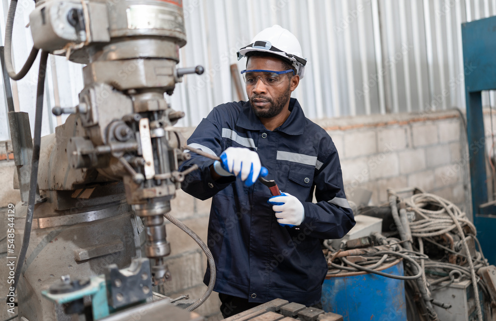 Portrait African American engineer work with machine at lathe factory Portrait African American engineer work with machine at lathe factory