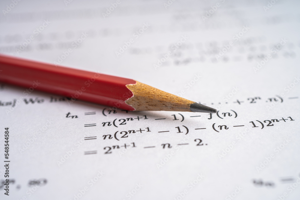 Pencil on mathematic formula exercise test paper in education school. Pencil on mathematic formula exercise test paper in education school.