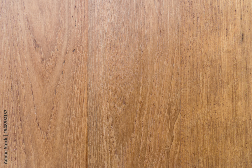 Fototapeta premium Natural wood grain wallpaper background, Walnut plank wall.