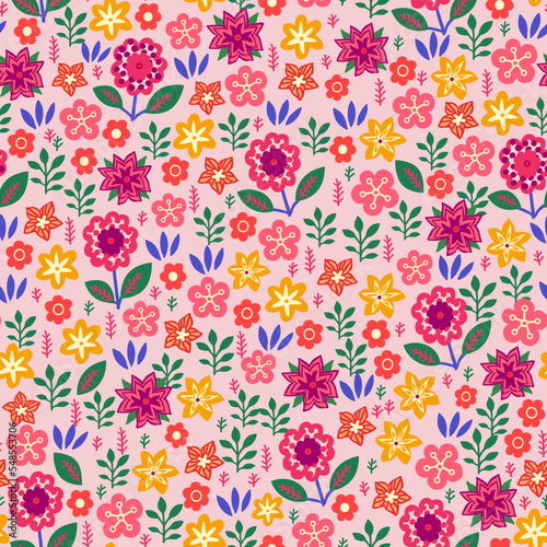 Amazing seamless floral pattern with bright multicolored flowers and leaves on a soft pink background. An elegant template for fashionable prints. Modern floral background. Folk style