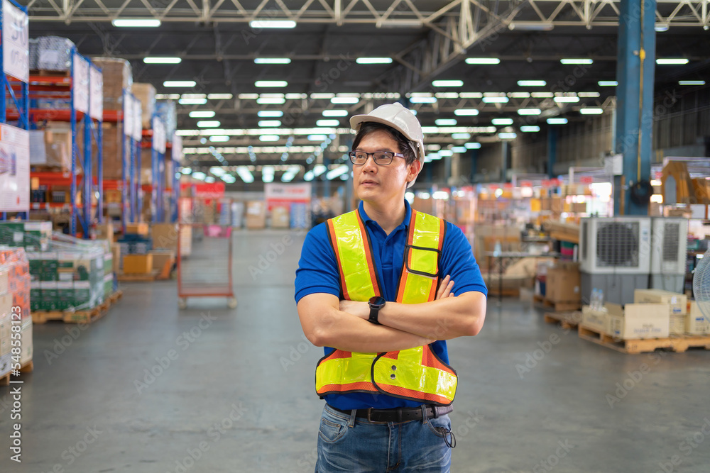 Portrait of Asian worker working in large warehouse retail store industry. Rack of stock storage. Interior of cargo in ecommerce and logistic concept. Depot. People lifestyle. Shipment service. Portrait of Asian worker working in large warehouse retail store industry. Rack of stock storage. Interior of cargo in ecommerce and logistic concept. Depot. People lifestyle. Shipment service.