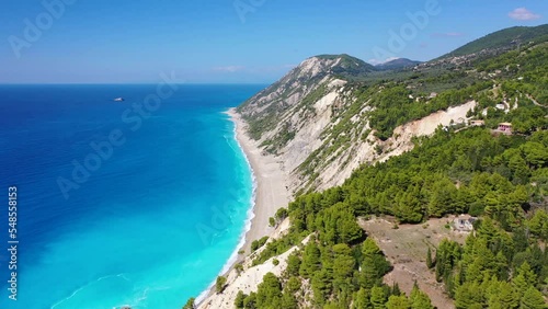 Aerial drone video of famous paradise beach of Egremni white steep rocky hills overlooking deep turquoise Ionian sea, Lefkada island photo