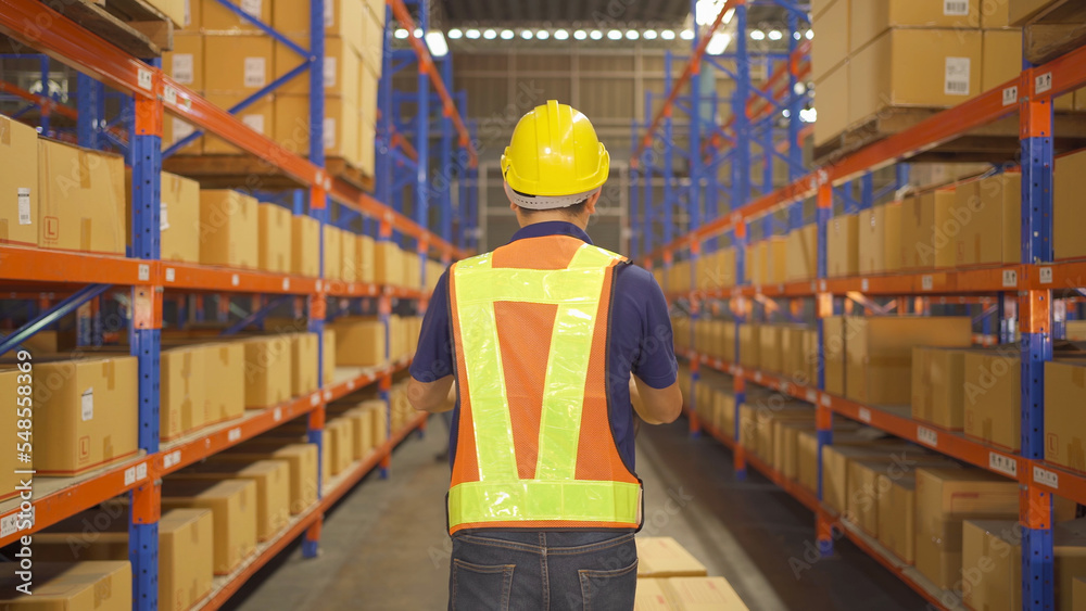 teamwork of Asian workers working in large warehouse retail store industry. Rack of stock storage. Interior of cargo in ecommerce and logistic concept. Depot. People lifestyle. Shipment service. teamwork of Asian workers working in large warehouse retail store industry. Rack of stock storage. Interior of cargo in ecommerce and logistic concept. Depot. People lifestyle. Shipment service.