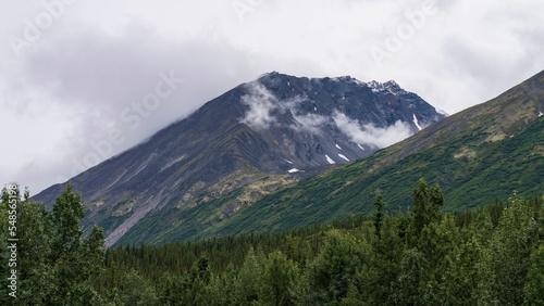 Scenic shot of the Alaska Range in the Southcentral region of Alaska, USA under a cloudy sky photo