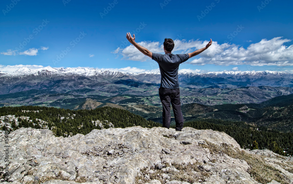 Man on top of the mountain with amazing views
Man on top of the mountain with amazing views