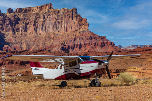 Airplane landed on a dirt runway photo