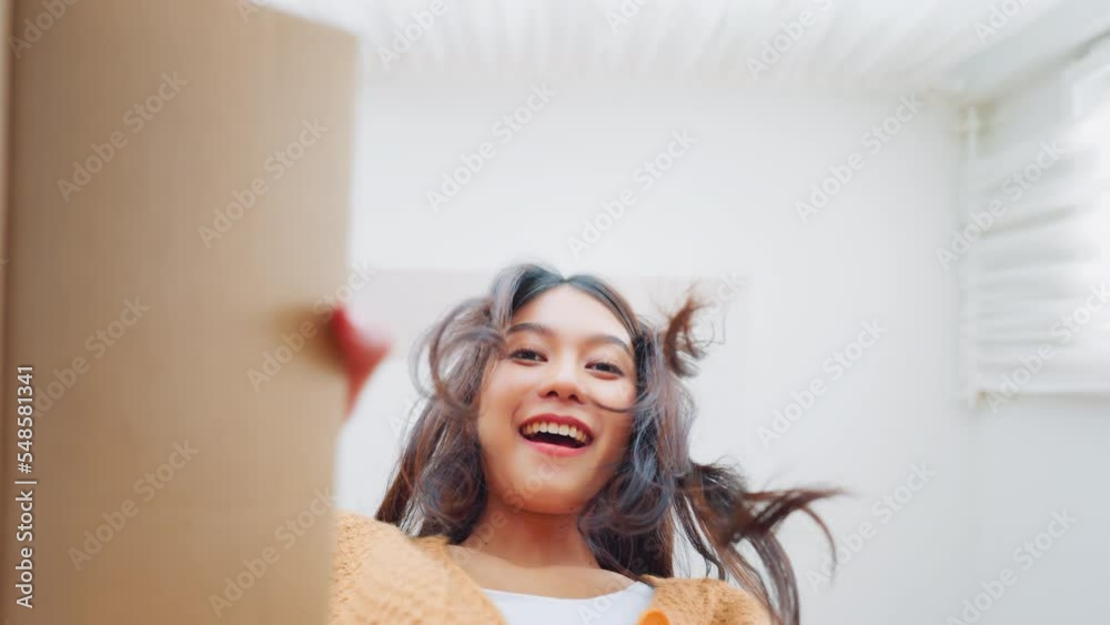 Surprise excited asian woman opening gift box, Inside view of carton box bottom, Satisfied client, positive feedback. Delivery and online shopping concept.