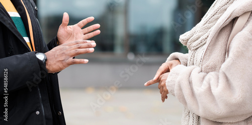 Close-up of two hands people using language sign.