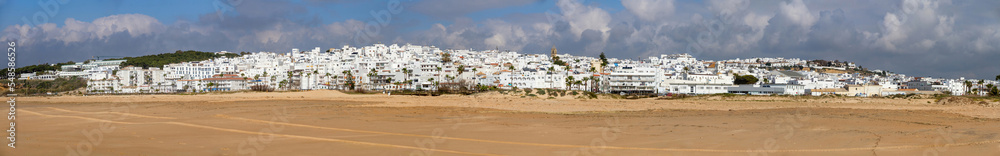 Panoramic view of the beach and the whitewashed village of Conil de la Frontera, Cadiz, Andalusia, Spain