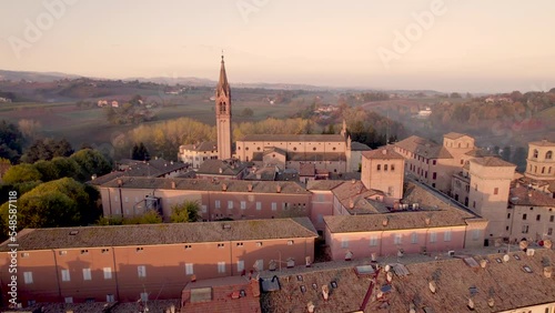  4K drone footage orbital flight of Castelvetro di Modena medieval village in Emilia Romagna during sunrise on a cold Fall morning photo