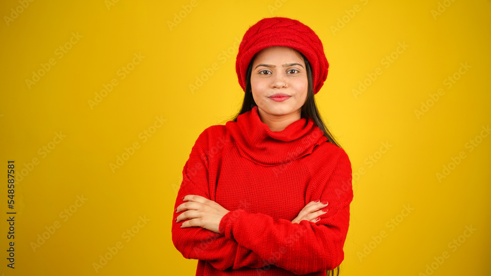 Young woman wearing winter clothes isolated over colour background, Beautiful girl wearing sweater