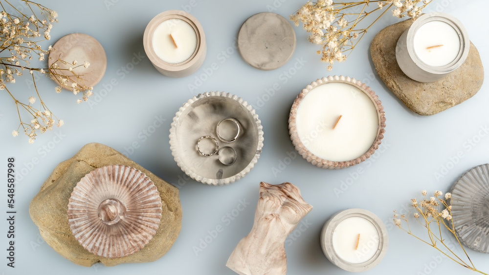 candles and handmade decor on a blue background, business for moms on maternity leave, space for text, top view candles and handmade decor on a blue background, business for moms on maternity leave, space for text, top view