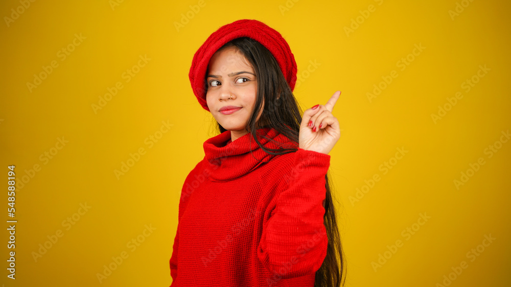 Young woman wearing winter clothes isolated over colour background, Beautiful girl wearing sweater Young woman wearing winter clothes isolated over colour background, Beautiful girl wearing sweater
