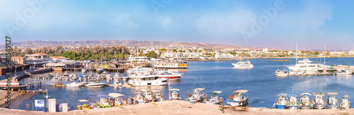 Paphos, Cyprus - September 08, 2022 : Panoramic view of Paphos harbour with boats and ships in Paphos, Cyprus