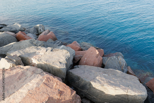 Group of stones on beach on shore of Red sea. Eilat, Israel