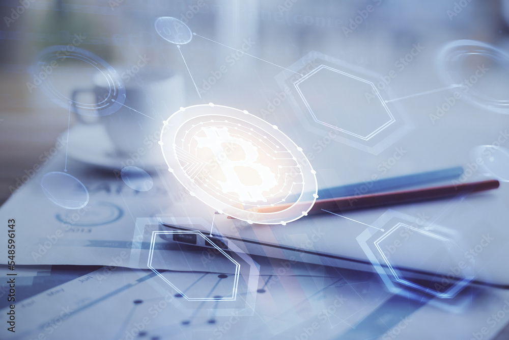 Double exposure of blockchain and crypto economy theme hologram and table with computer background. Concept of bitcoin cryptocurrency. Double exposure of blockchain and crypto economy theme hologram and table with computer background. Concept of bitcoin cryptocurrency.