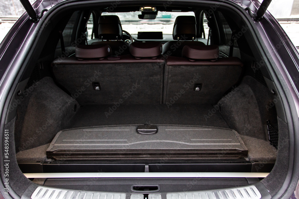 Huge, clean and empty car trunk in interior of compact suv. Rear view of a SUV car with open trunk