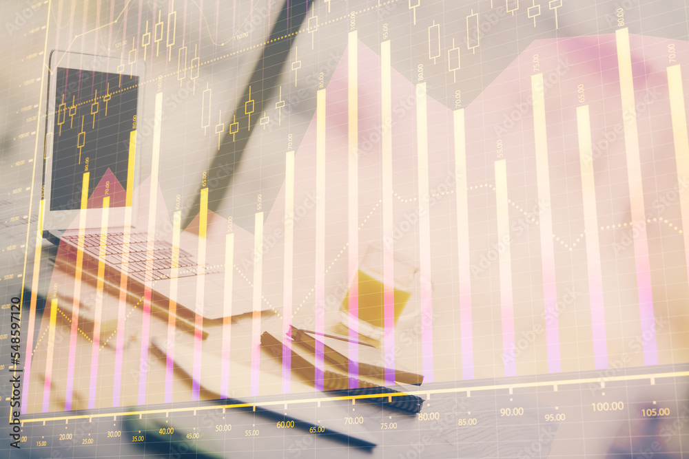 Forex graph hologram on table with computer background. Multi exposure. Concept of financial markets. Forex graph hologram on table with computer background. Multi exposure. Concept of financial markets.