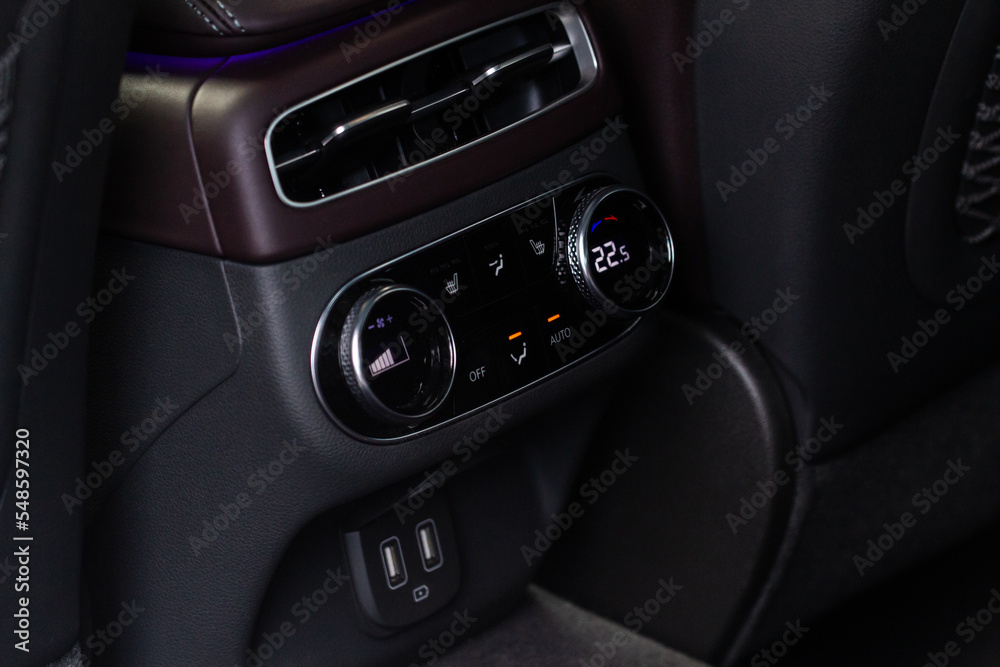 Digital control panel car air conditioner dashboard. Modern car interior conditioning buttons inside a car close up view.