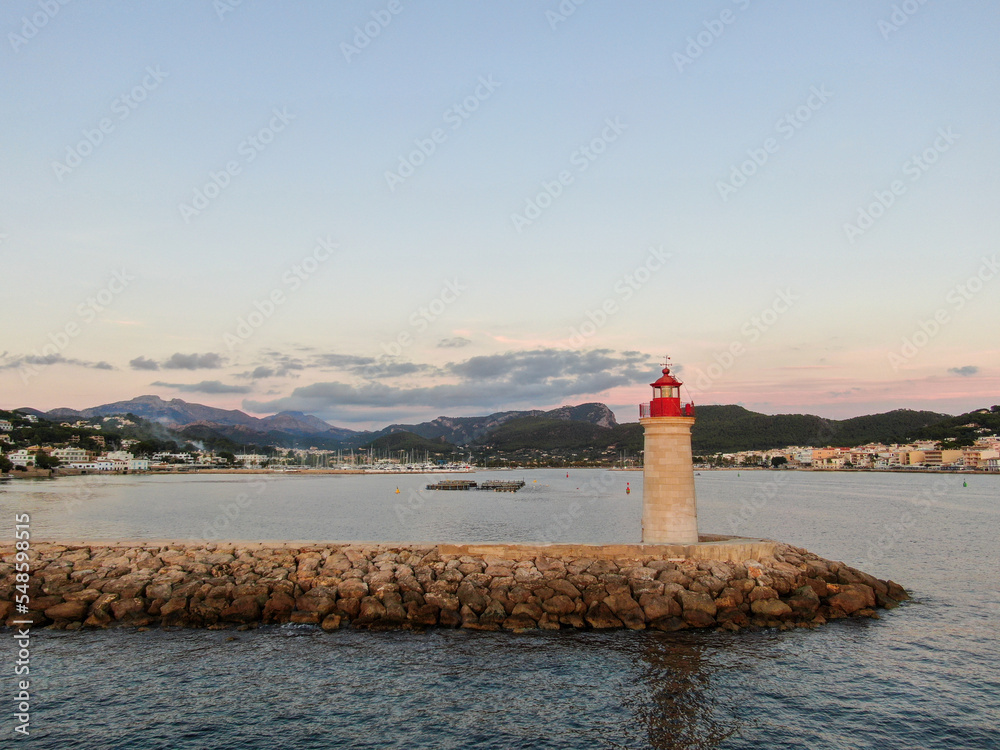 Panoramic view of a lighthouse standing in the coast of Mallorca	
