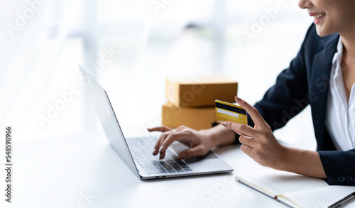 Asian businesswoman hands holding smartphone shopping online with a credit card. Online Payment. Online shopping
