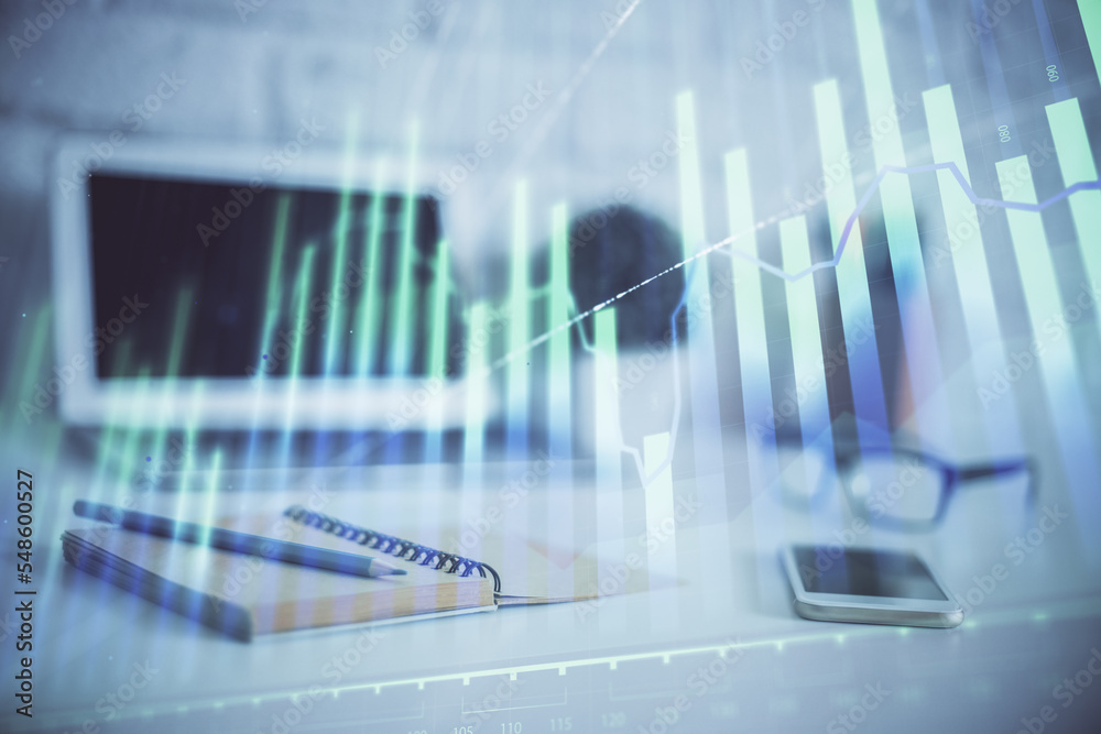 Forex graph hologram on table with computer background. Multi exposure. Concept of financial markets. Forex graph hologram on table with computer background. Multi exposure. Concept of financial markets.