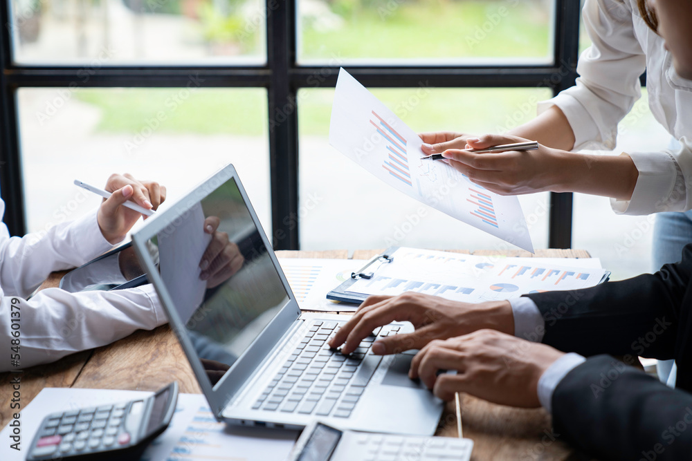 business people meeting in the office Calculate the tax and income of the company's investment. Strategic Planning and Brainstorming colleague concept, report, analyze graph plans