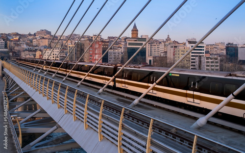 railways and subways. View of the Istanbul Golden Horn metro bridge tracks at sunset.