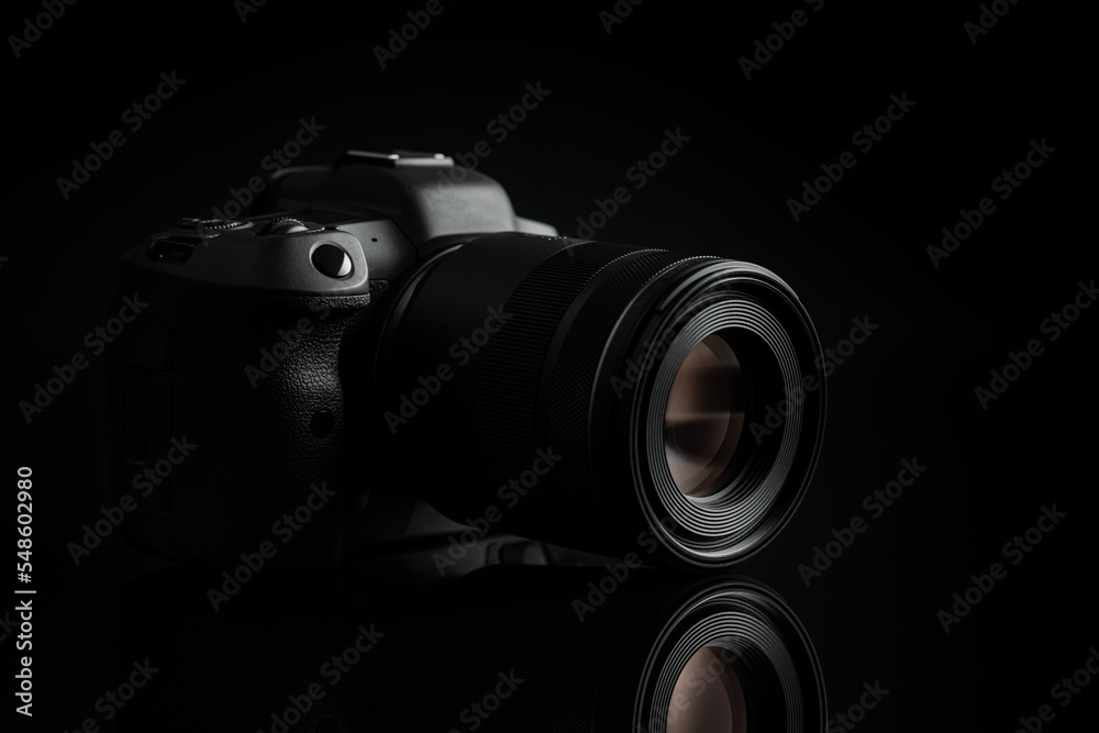 © Jiri Hera - Digital mirrorless camera on black background.