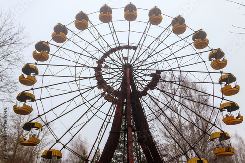 Abandoned Ferris Wheel in the amusement park of ghost town Pripyat in Chernobyl Exclusion Zone, Ukraine