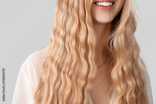 Young smiling woman with bl...