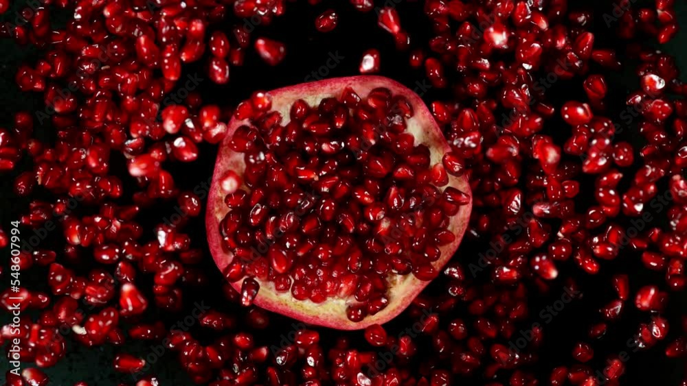 Fresh sliced pomegranate flying, super slow motion filmed on high speed cinematic camera at 1000 fps