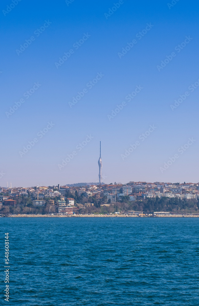 view of Istanbul from the Bosphorus, Çamlıca Tower and the Istanbul skyline. Bosphorus on a sunny day.