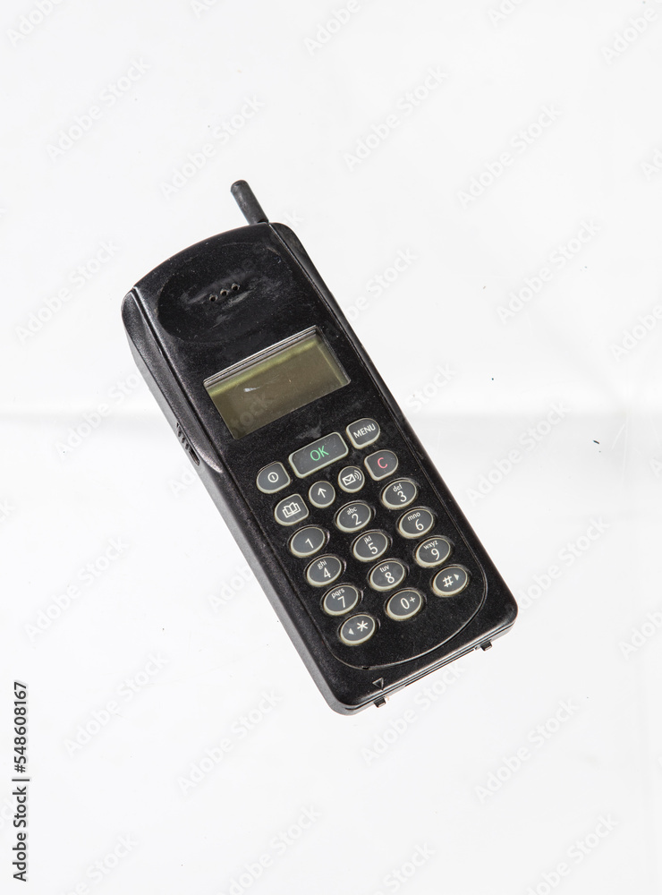 Old telephone isolated white background