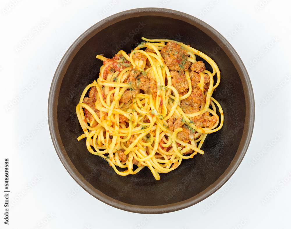 the finished dish. Spaghetti with meat sauce. Top view on a white background, isolate the finished menu.