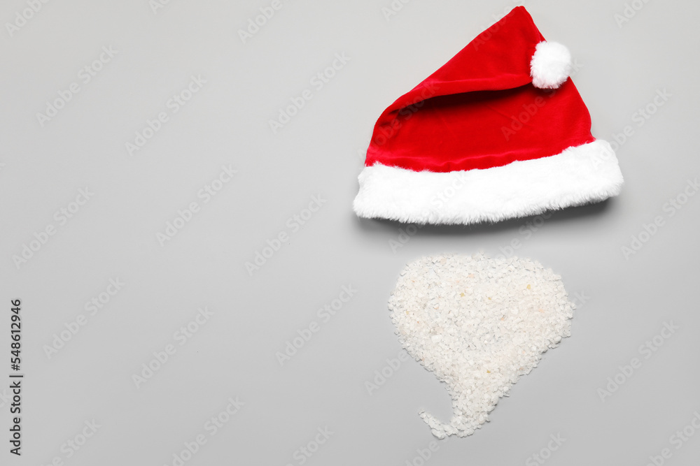 Santa hat and beard made of raw rice on light background Santa hat and beard made of raw rice on light background