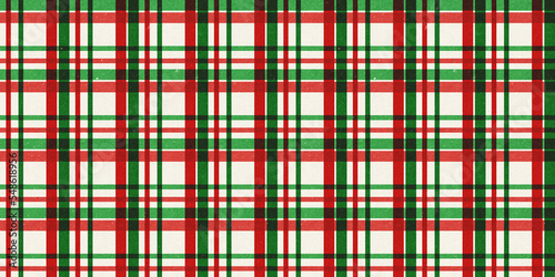 Red and green vintage rough kraft textured seamless tartan or plaid stripes Christmas decoration pattern. Classic xmas card background or gift wrap, wrapping paper or, winter holiday backdrop.