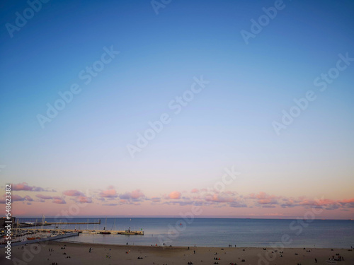 Beautiful beach sea  sky and pink clouds. Gdynia