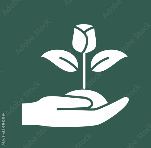 White farming icon. Sticker with gardener hand holding beautiful blooming flower. Horticulture and agriculture. Design element for web and print. Cartoon flat vector illustration on green background