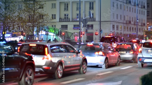 Evening city life in the centre. Cars on street. City street lights at night. © Grand Warszawski