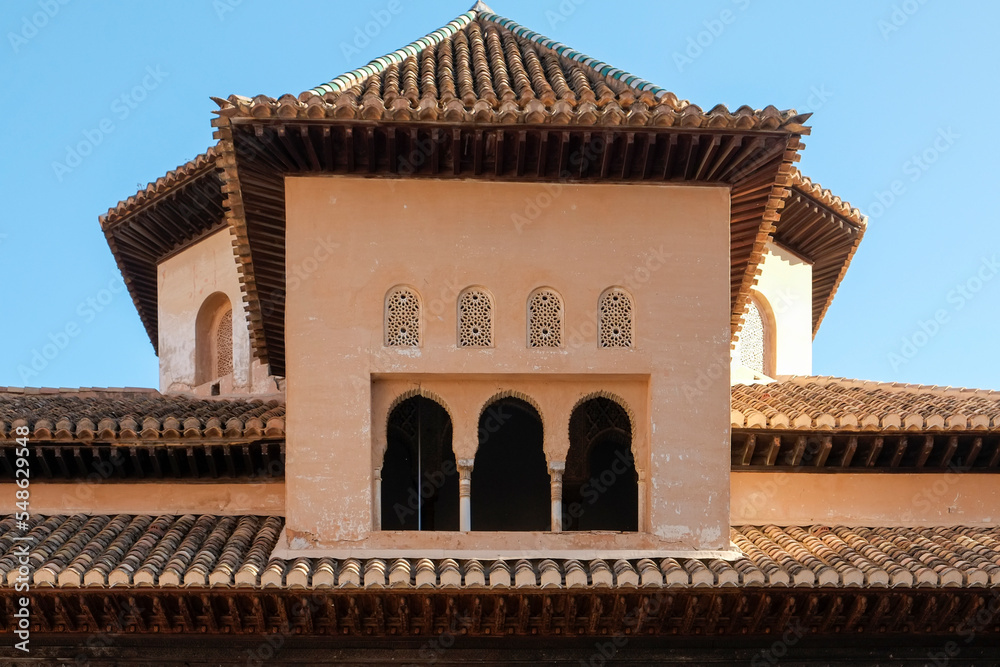 Spain, Granada, Arched windows and tiled roof of the Alhambra Spain, Granada, Arched windows and tiled roof of the Alhambra